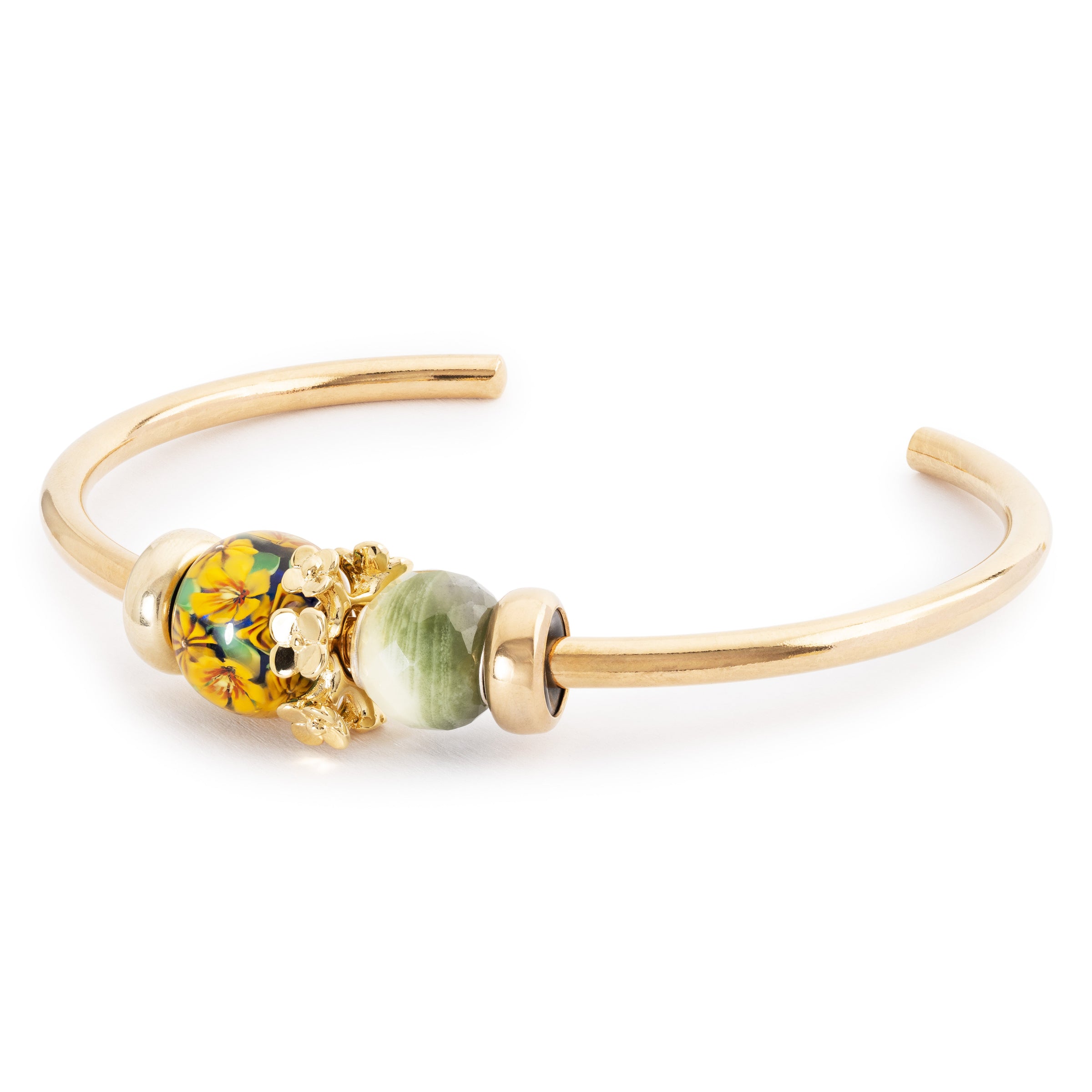 Gold bracelet with colorful beads on a white background