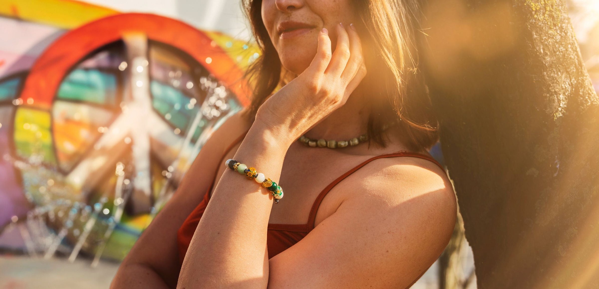 Woman with a colorful peace symbol in the background
